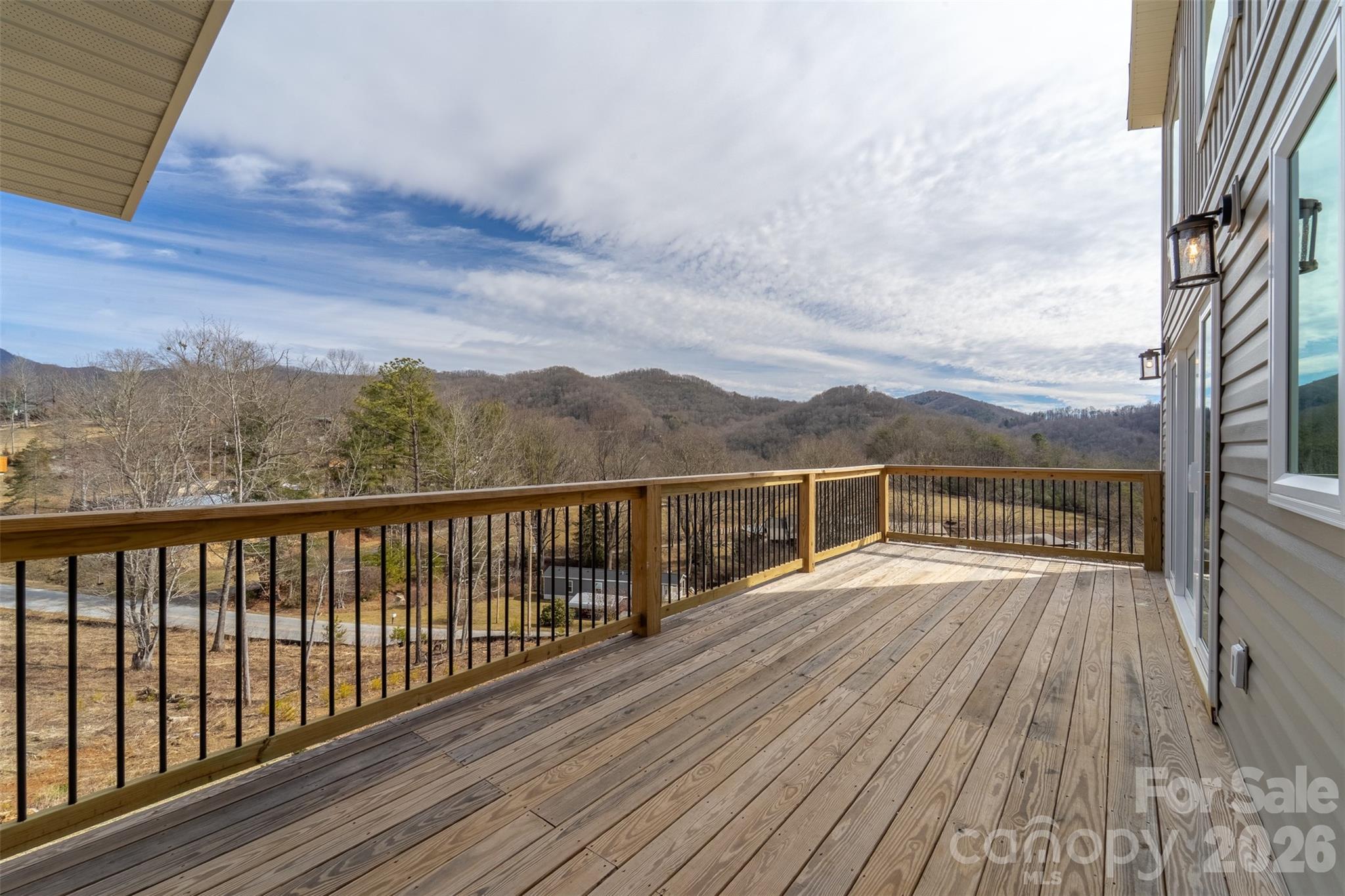 1012 Sols Creek Church Road Tuckasegee, NC 28783 - Photo 3 of 25 a view of balcony with wooden floor and fence