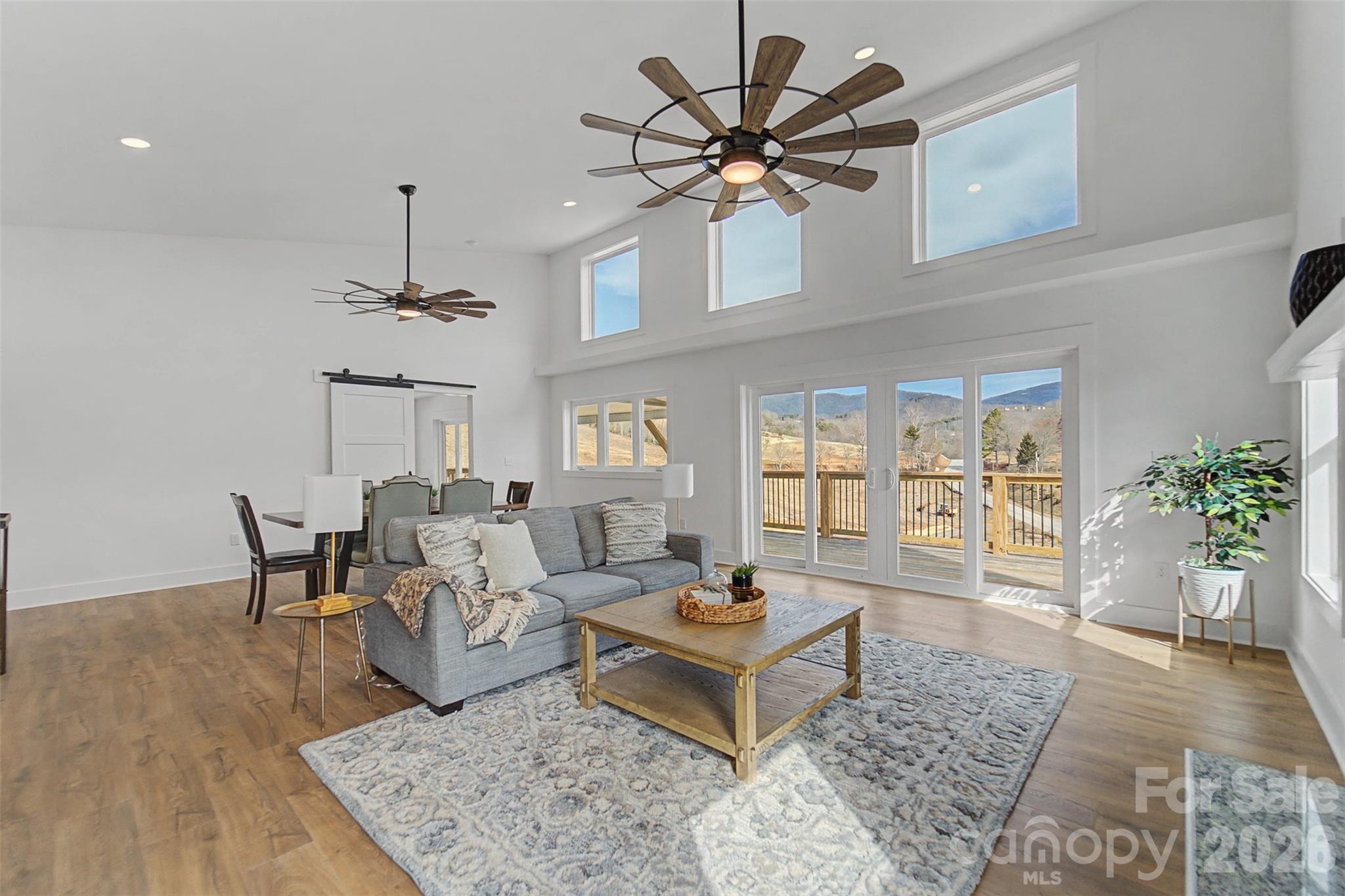 1012 Sols Creek Church Road Tuckasegee, NC 28783 - Photo 6 of 25 a living room with furniture and a chandelier