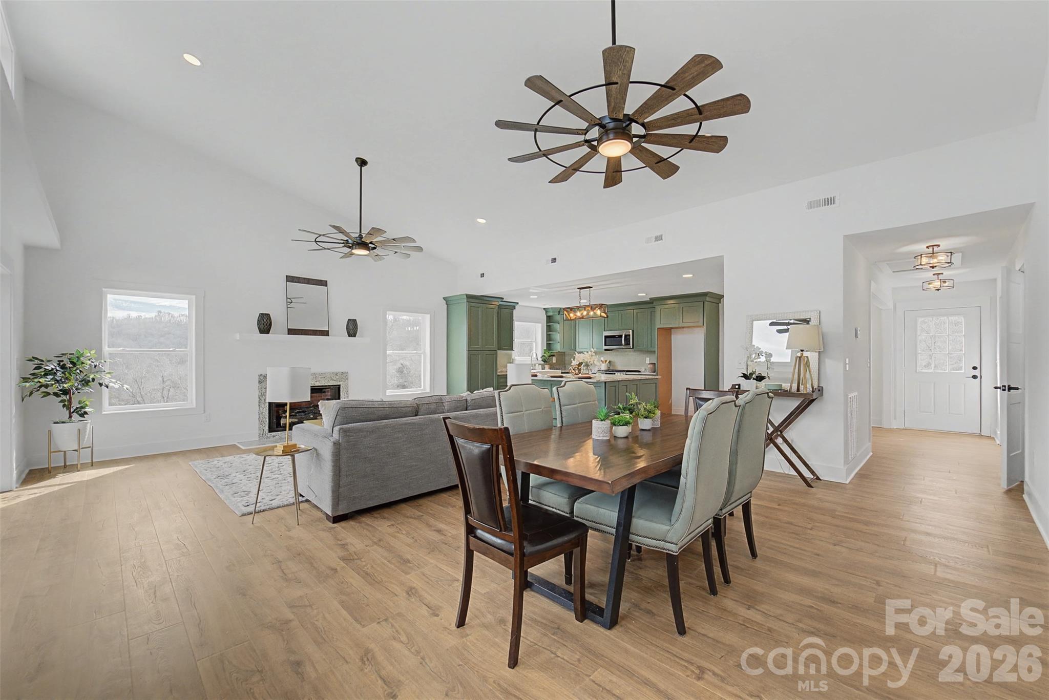 1012 Sols Creek Church Road Tuckasegee, NC 28783 - Photo 10 of 25 a view of a dining room with furniture and wooden floor