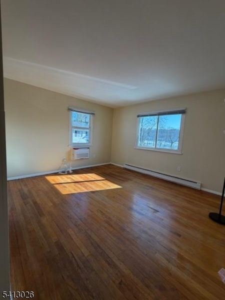 113 D North Shore Point Montague, NJ 07827 - Photo 12 of 18 an empty room with wooden floor and windows