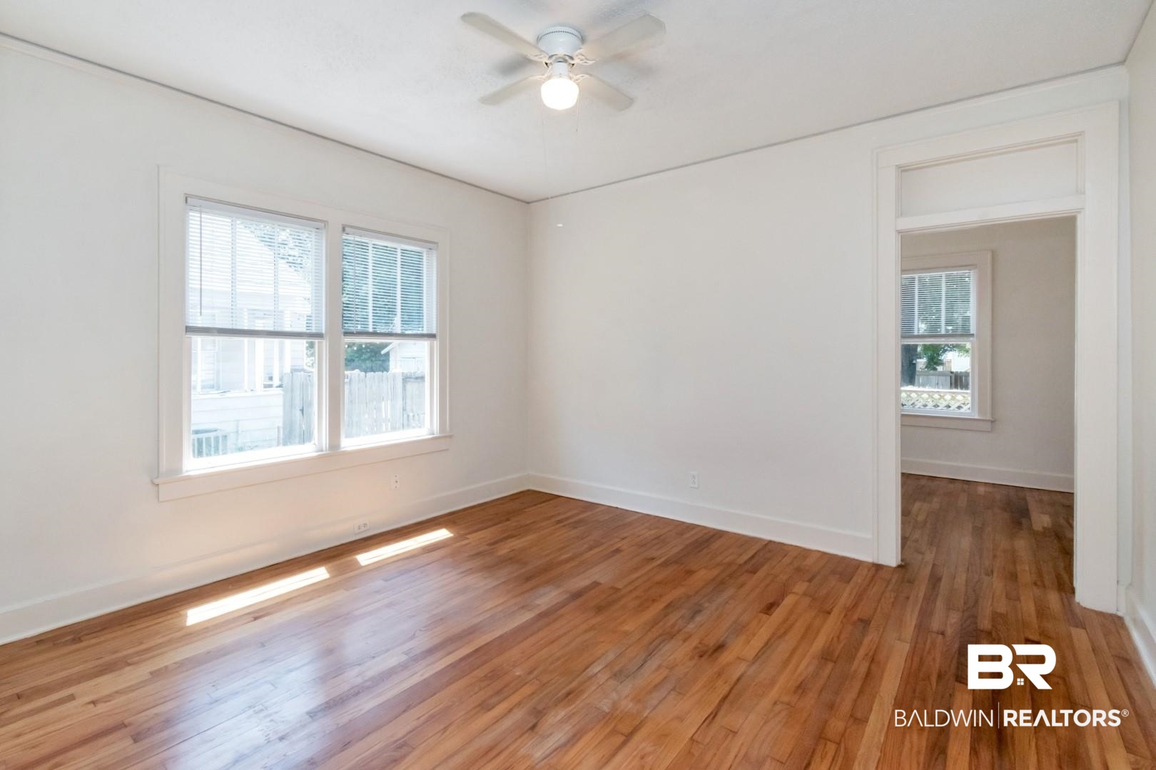 112 South Fulton Street Mobile, AL 36606 - Photo 23 of 35 Empty room featuring ceiling fan and hardwood / wood-style flooring