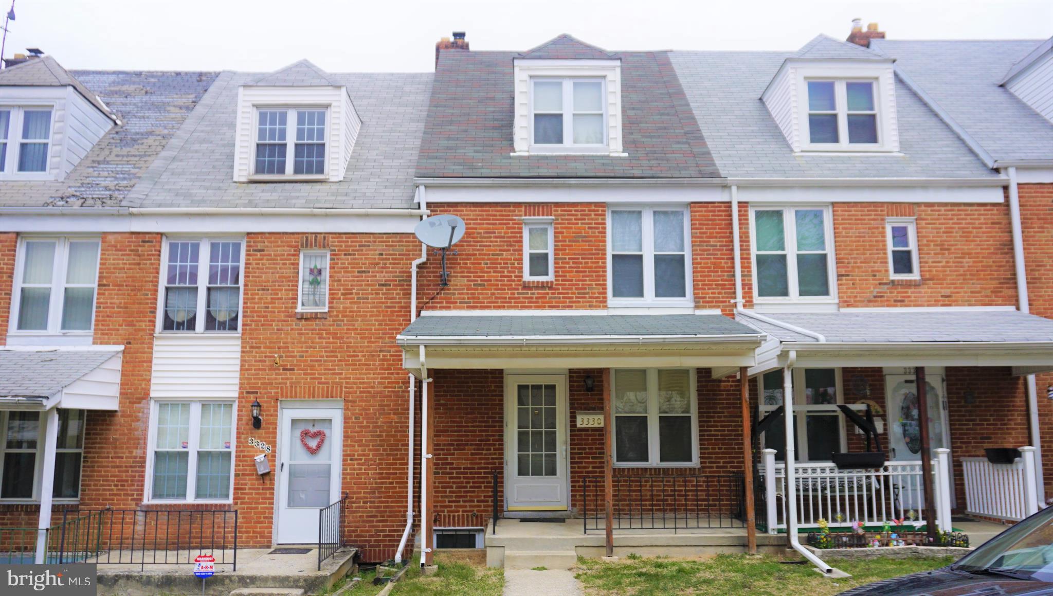 Brick rowhome with covered front porch