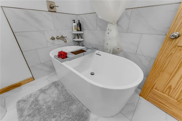 a spacious bathroom with a sink a toilet and shower