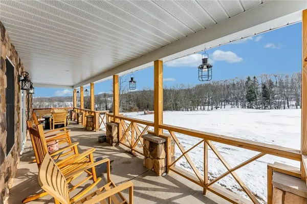 a view of swimming pool with seating area and furniture
