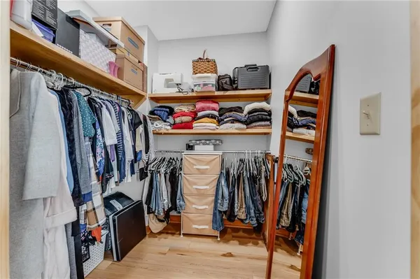 a bathroom with a toilet a sink a vanity and mirror