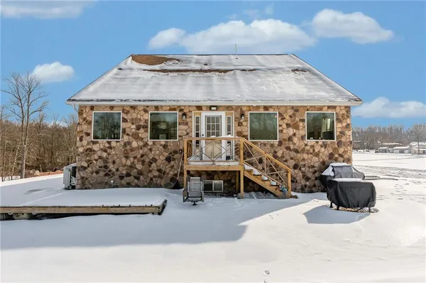 an aerial view of a house and trees