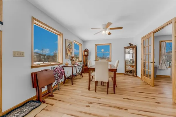 a view of a dining room with furniture window and wooden floor