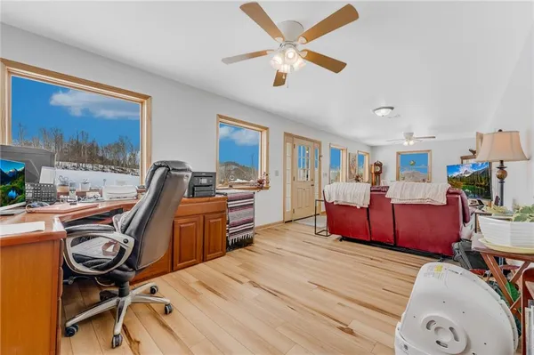 a bed room with furniture and a flat screen tv