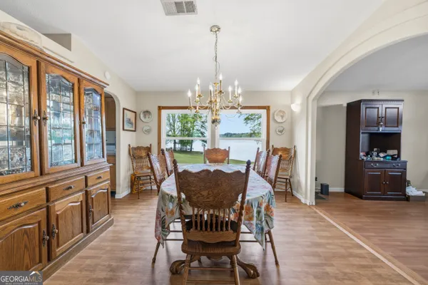 a view of a dining room with furniture window and wooden floor