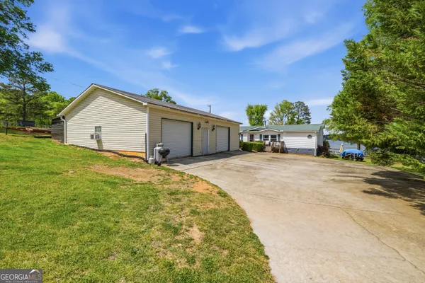 a view of a house with a yard