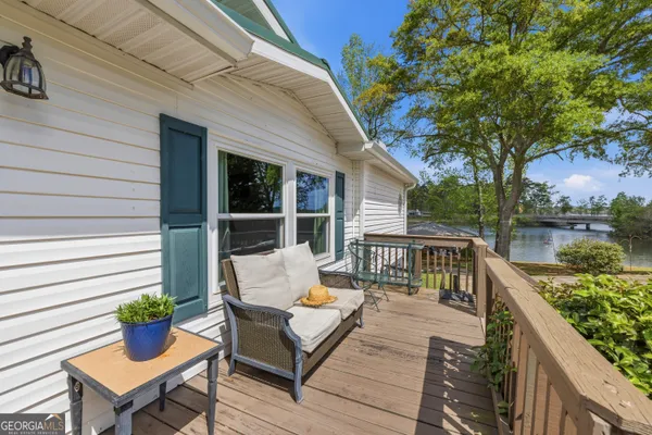 a view of a deck with furniture