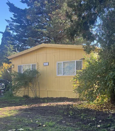 a view of a backyard of the house