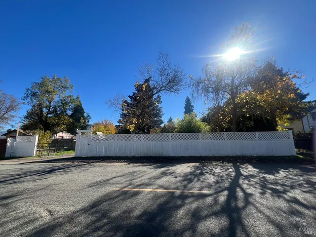a view of a street with some trees