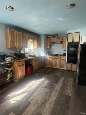 a living room with furniture and a mirror