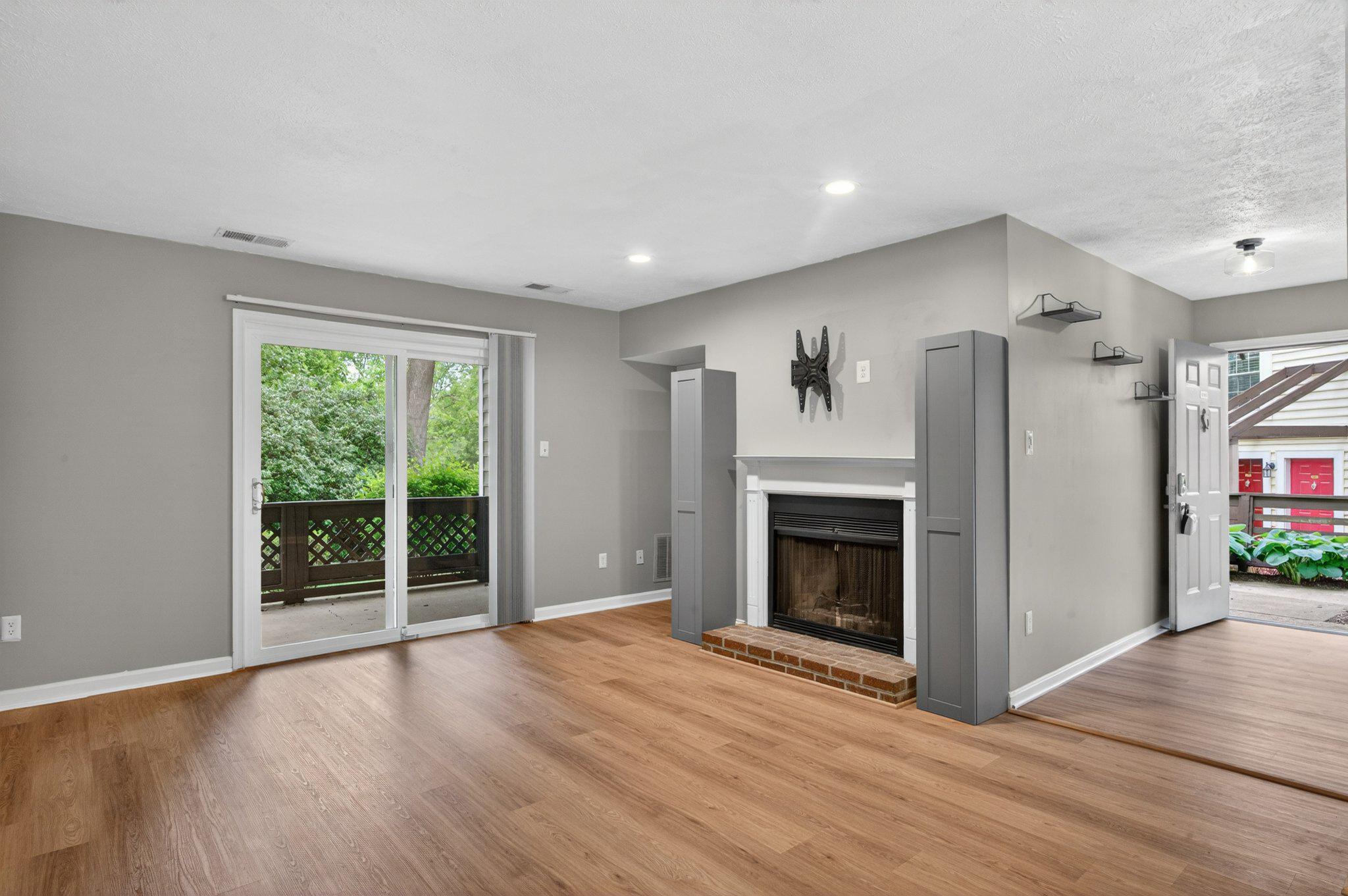10146 Oakton Terrace Road, Unit 10146 Oakton, VA 22124 - Photo 12 of 25 Livingroom w/ Woodburning Fireplace