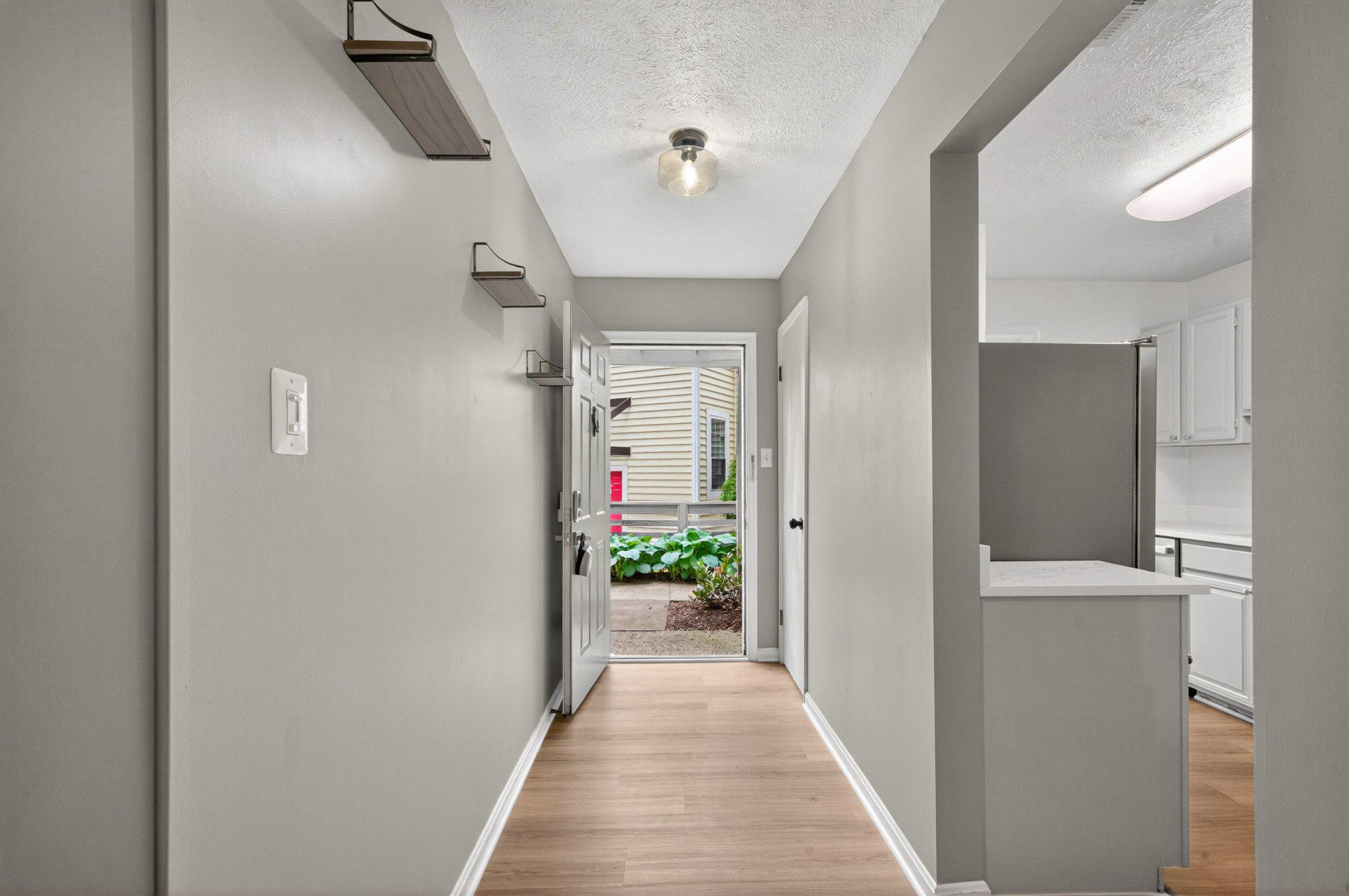 10146 Oakton Terrace Road, Unit 10146 Oakton, VA 22124 - Photo 5 of 25 Bright and Inviting entryway space w/ coat closet.