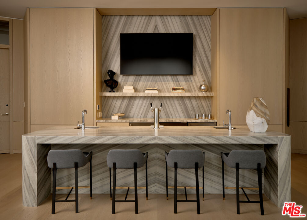 211 Elm Court, Unit 35B Los Angeles, CA 90067 - Photo 14 of 22 a kitchen with a table and chairs in it