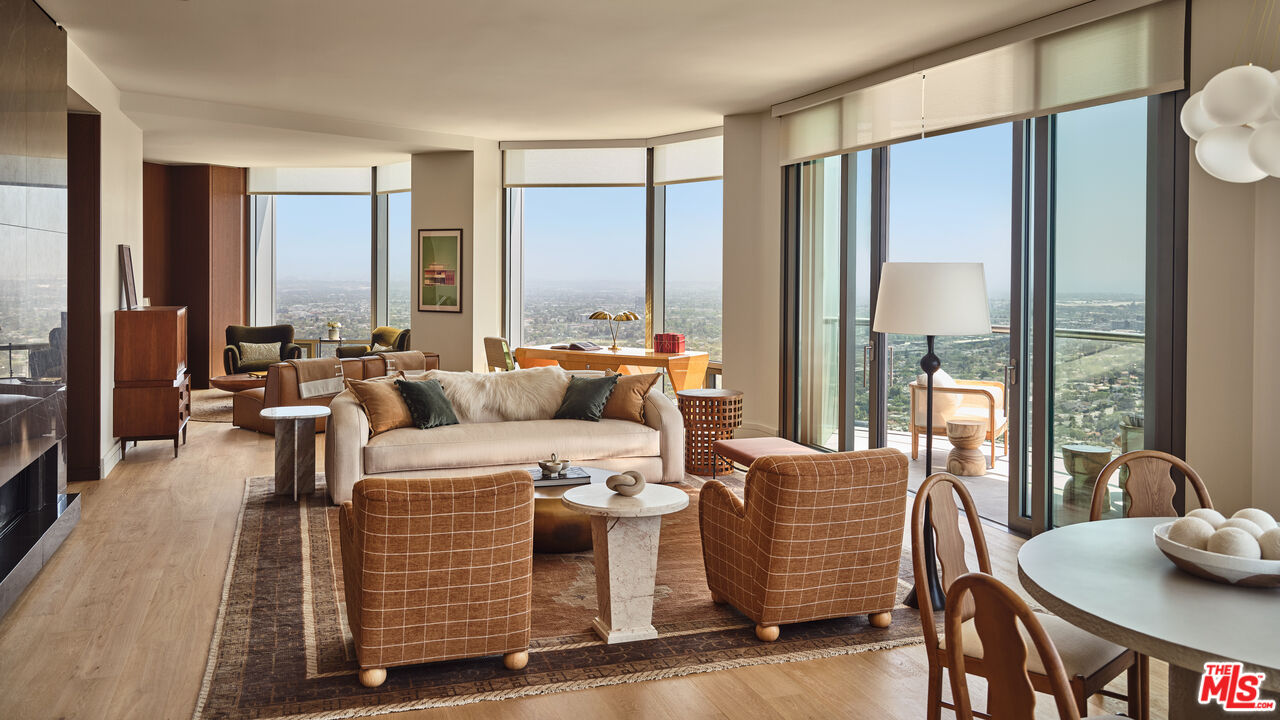 211 Elm Court, Unit 35B Los Angeles, CA 90067 - Photo 4 of 22 a living room with furniture and large windows