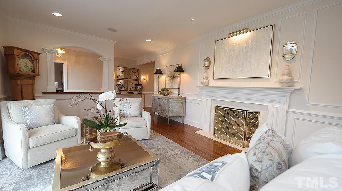 414 Yarmouth Road Raleigh, NC 27608 - Photo 11 of 42 a living room with furniture and a fireplace