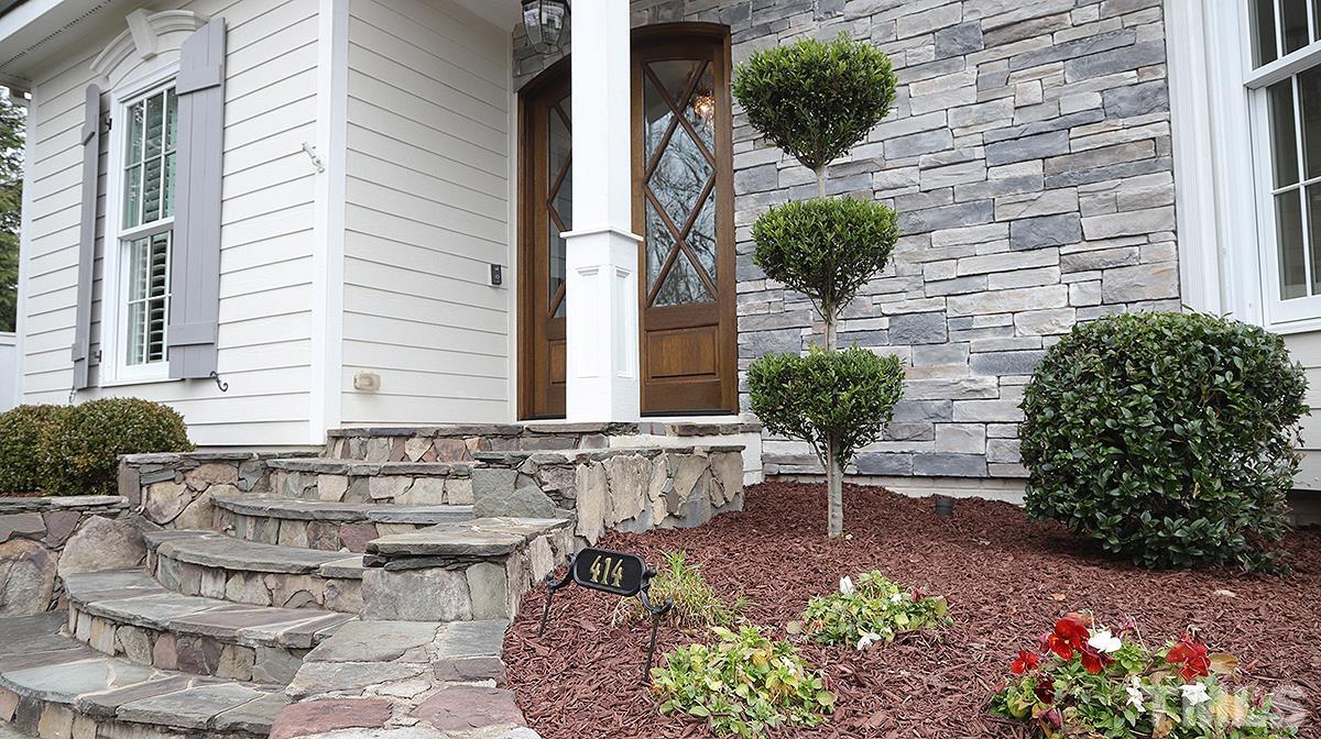 414 Yarmouth Road Raleigh, NC 27608 - Photo 2 of 42 a view of a chairs and table in the backyard