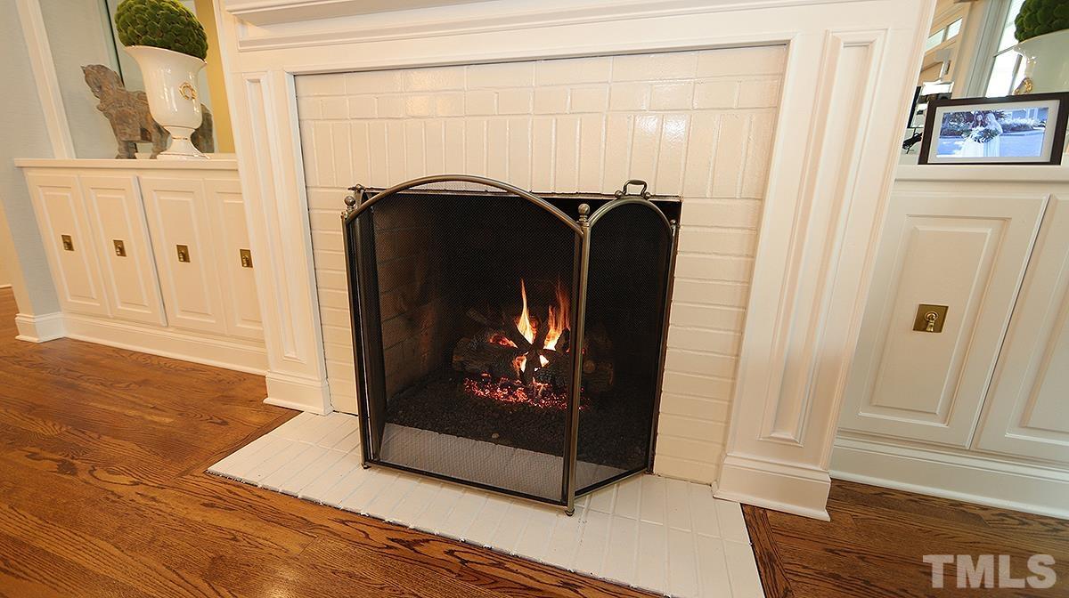 414 Yarmouth Road Raleigh, NC 27608 - Photo 24 of 42 a view of a fireplace in a room