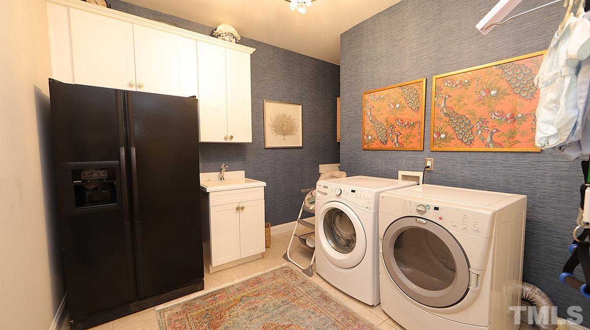 414 Yarmouth Road Raleigh, NC 27608 - Photo 27 of 42 a utility room with dryer and washer