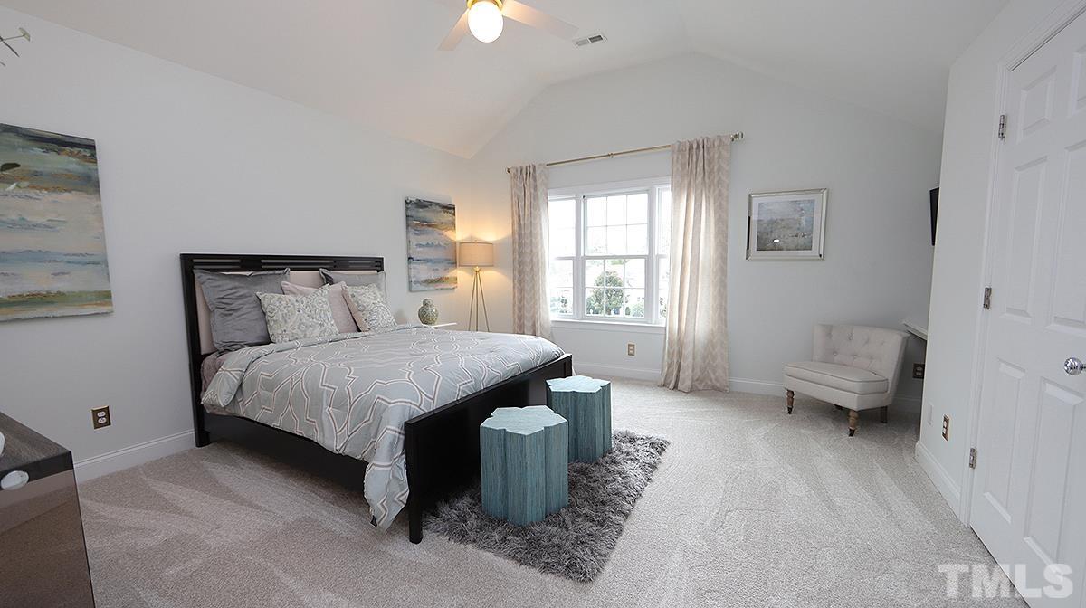 414 Yarmouth Road Raleigh, NC 27608 - Photo 31 of 42 a bedroom with a bed and a couch