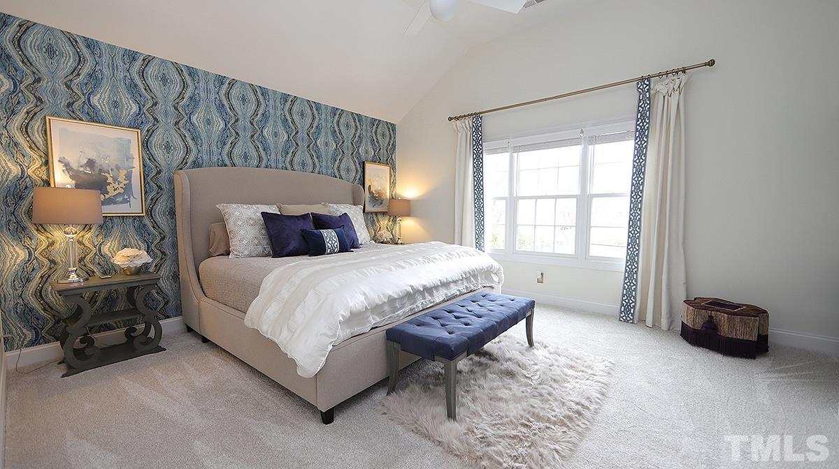 414 Yarmouth Road Raleigh, NC 27608 - Photo 35 of 42 a bedroom with a bed and a tv