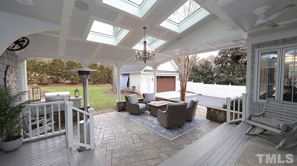 414 Yarmouth Road Raleigh, NC 27608 - Photo 38 of 42 a living room with patio furniture and a large window