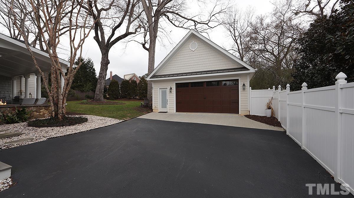 414 Yarmouth Road Raleigh, NC 27608 - Photo 41 of 42 a front view of a house with a yard and garage