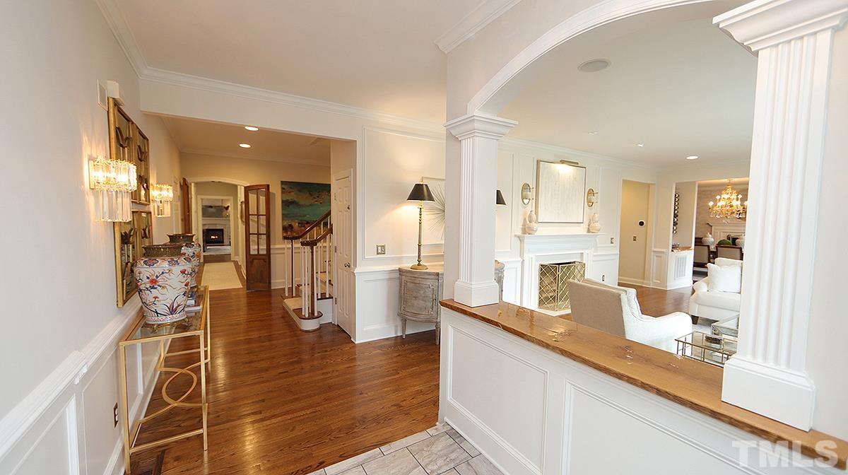 414 Yarmouth Road Raleigh, NC 27608 - Photo 7 of 42 a view of a kitchen with refrigerator and wooden floor