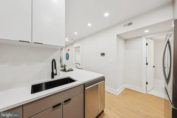 a en suite bathroom with a sink and mirror