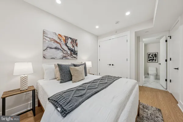 a bedroom with a bed and a table in it