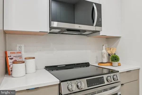 a kitchen with appliances a sink and a stove