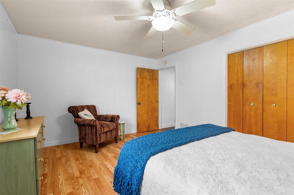 417 West 8th Street Justin, TX 76247 - Photo 18 of 40 a bedroom with a bed and furniture
