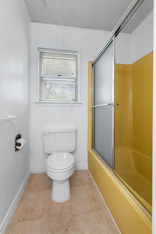 417 West 8th Street Justin, TX 76247 - Photo 20 of 40 a bathroom with a toilet and a shower