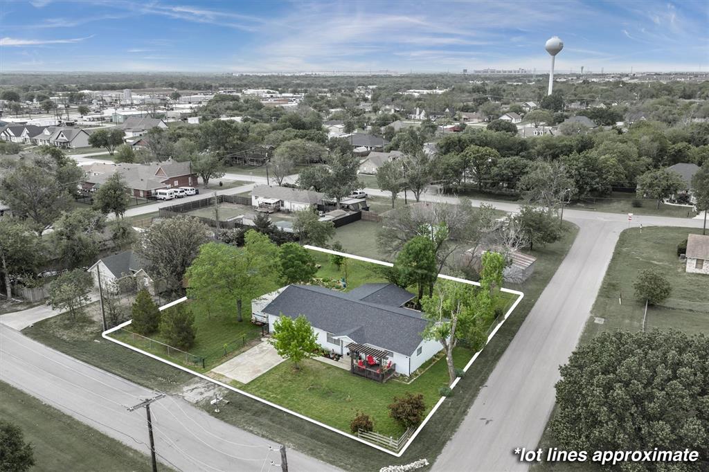 417 West 8th Street Justin, TX 76247 - Photo 2 of 40 an aerial view of residential houses with city view