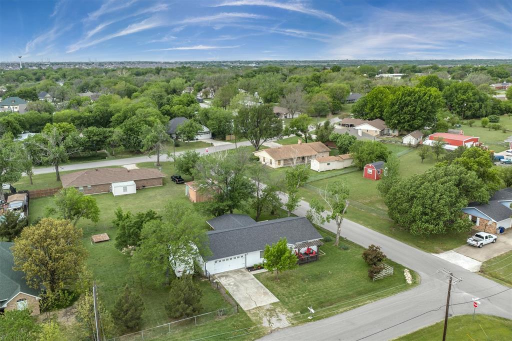 417 West 8th Street Justin, TX 76247 - Photo 29 of 40 a view of a house with a garden