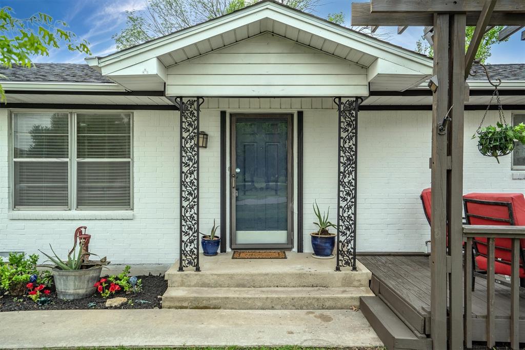 417 West 8th Street Justin, TX 76247 - Photo 3 of 40 a view of a entryway door front of house