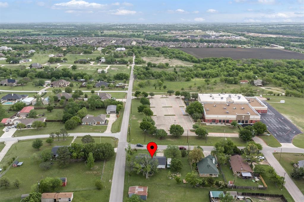 417 West 8th Street Justin, TX 76247 - Photo 35 of 40 an aerial view of residential houses with outdoor space and lake view