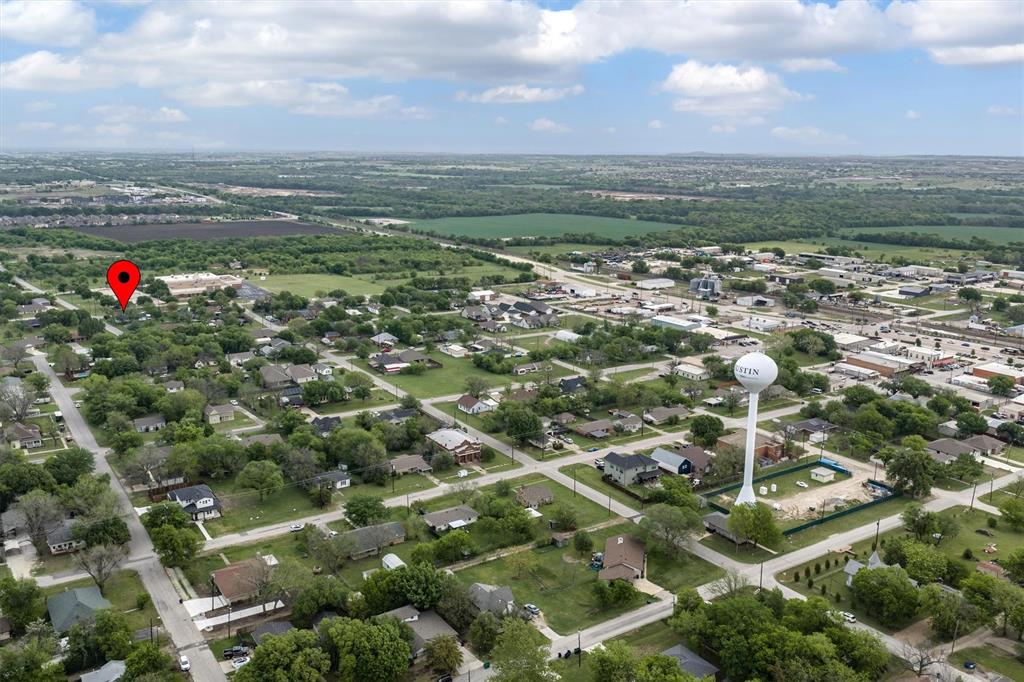 417 West 8th Street Justin, TX 76247 - Photo 36 of 40 an aerial view of residential houses with outdoor space