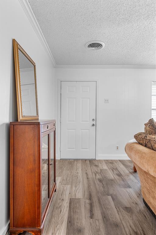 417 West 8th Street Justin, TX 76247 - Photo 6 of 40 a view of empty room with wooden floor