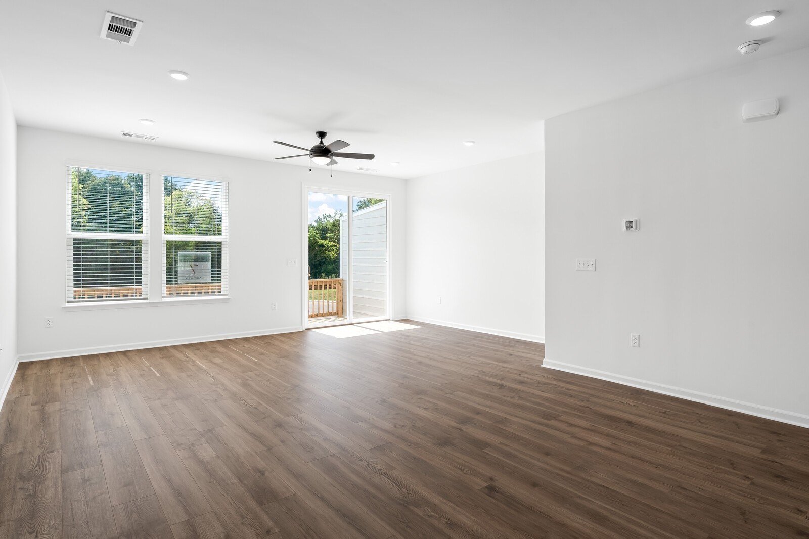 402 Blair Road Smyrna, TN 37167 - Photo 8 of 27 a view of an empty room with wooden floor and a window