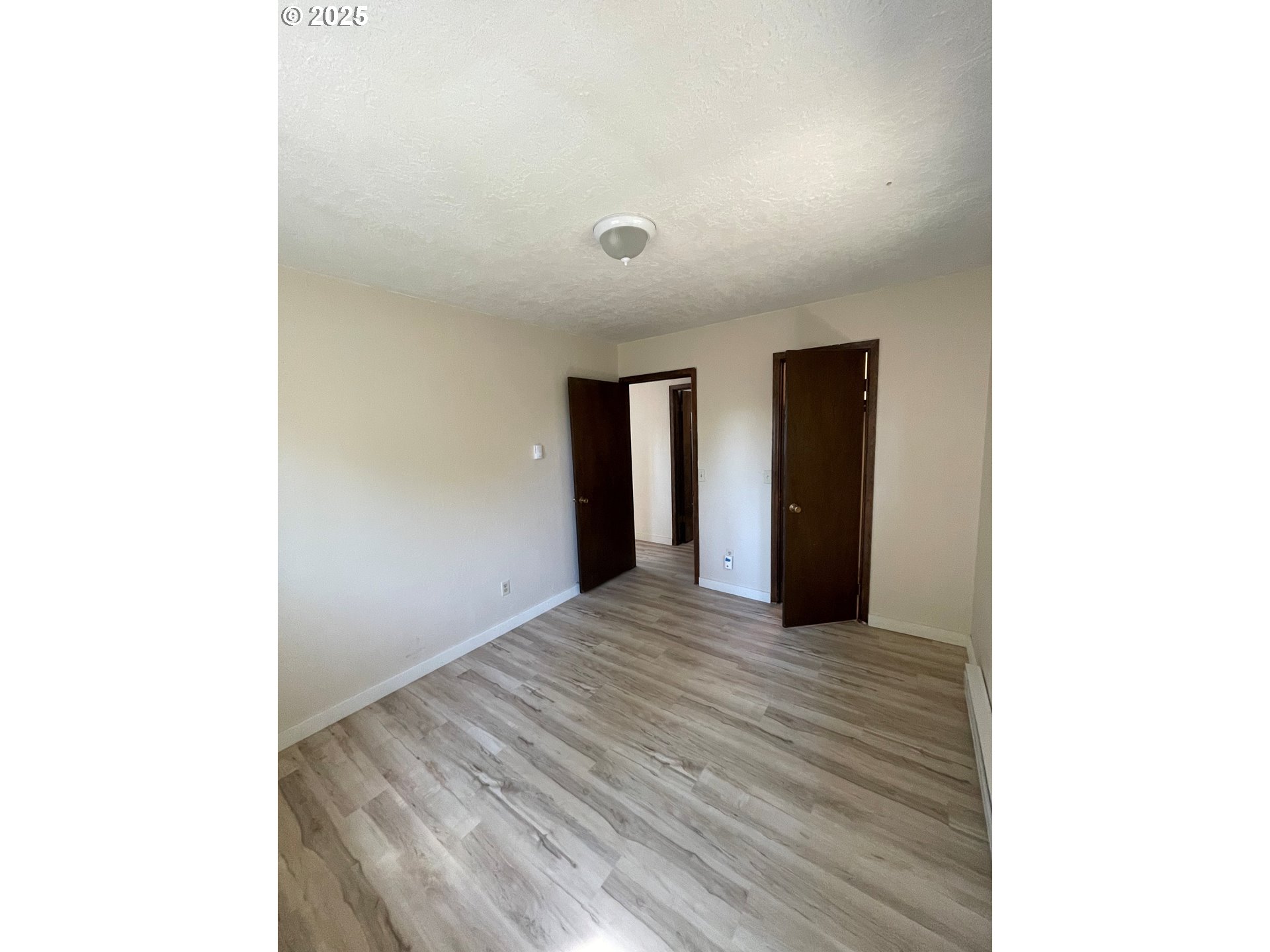 903 Southwest Pucker Huddle Road White Salmon, WA 98672 - Photo 7 of 10 a view of an empty room with closet and a window