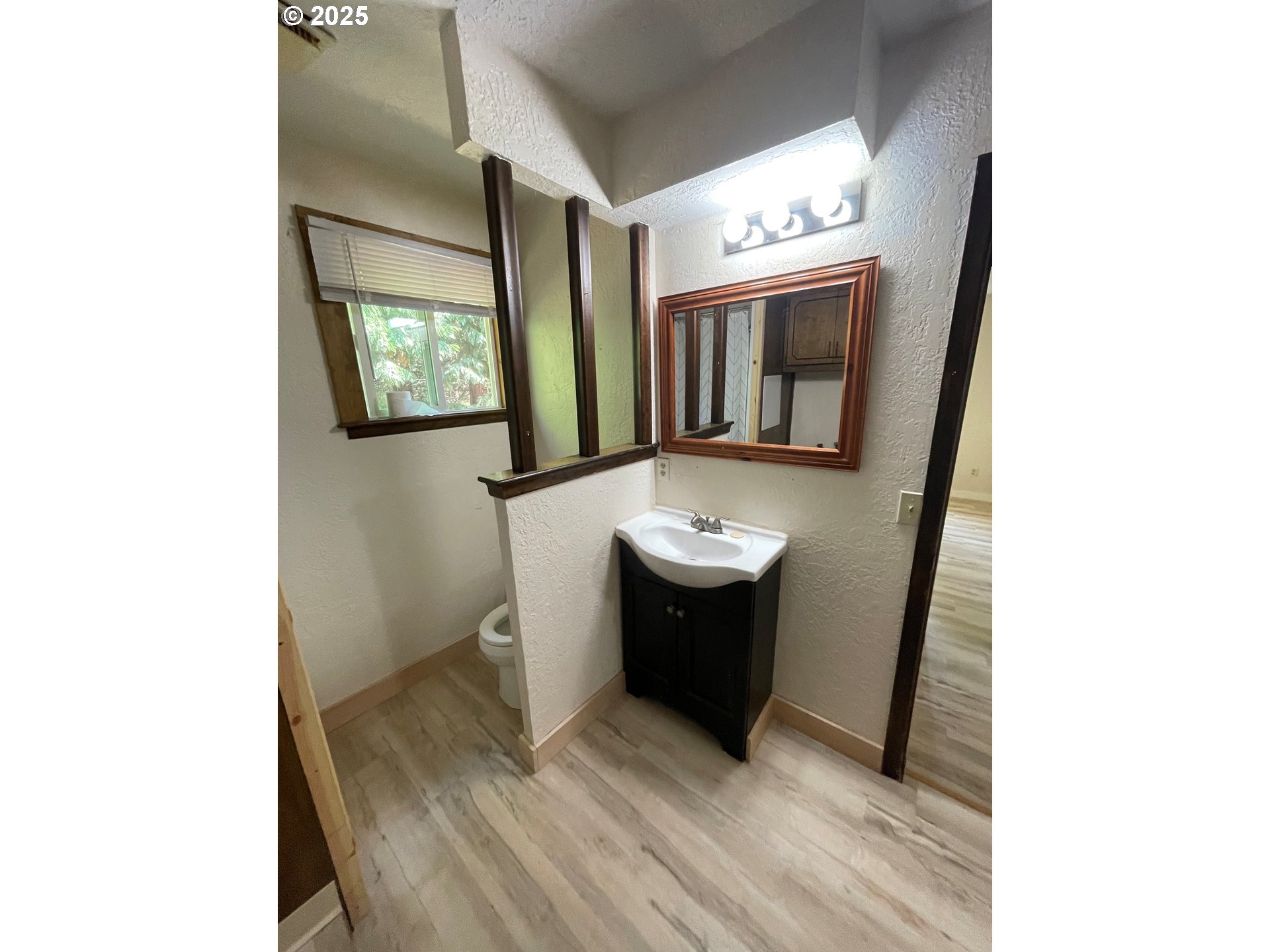 903 Southwest Pucker Huddle Road White Salmon, WA 98672 - Photo 9 of 10 a bathroom with a sink and mirror