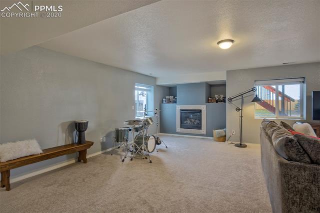 8345 Fort Smith Road Peyton, CO 80831 - Photo 36 of 50 Basement showing gas fireplace