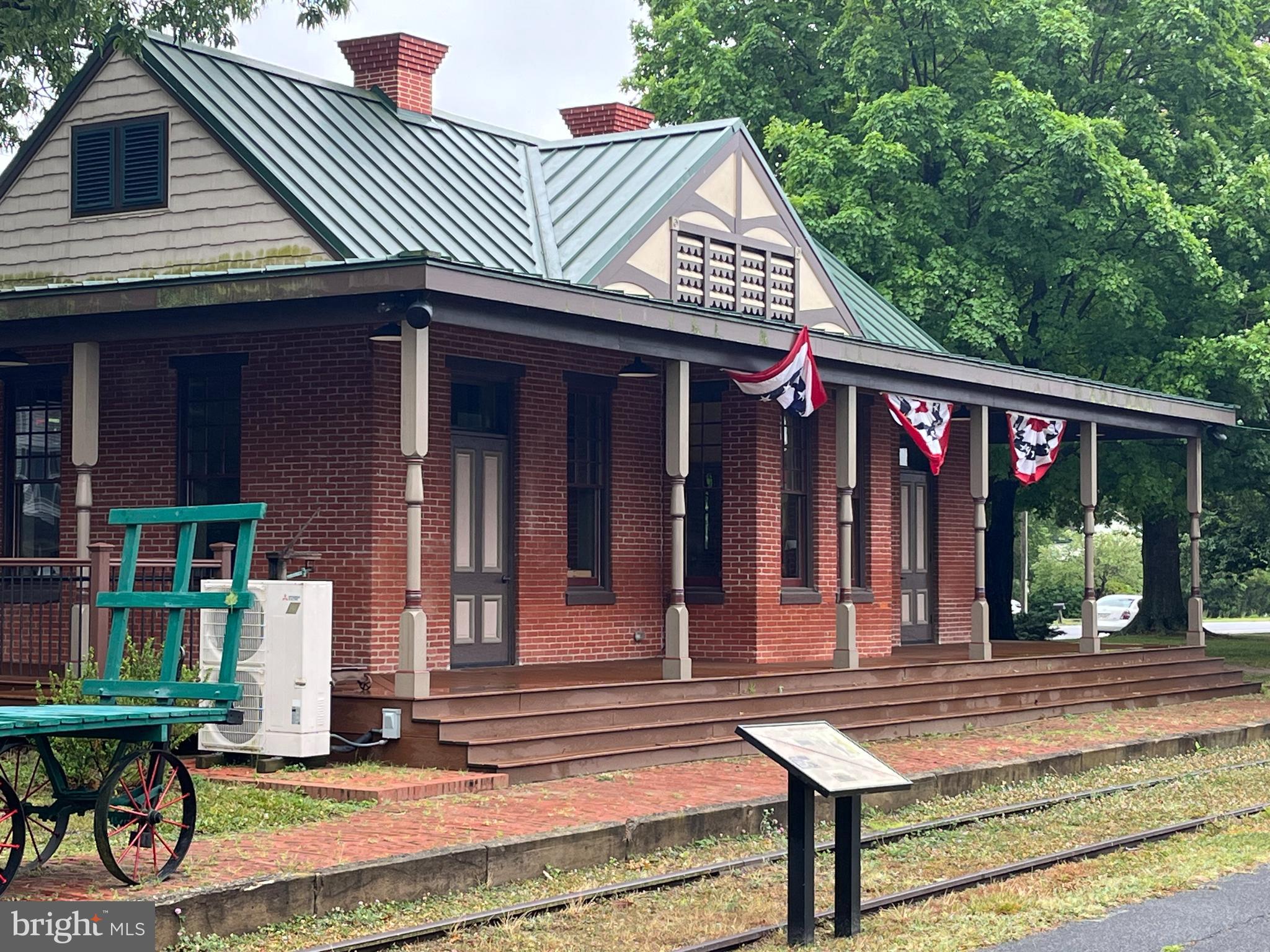 Burnt Mill Road, Unit 2 Ridgely, MD 21660 - Photo 3 of 5 a front view of a house with garden