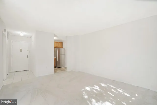 a view of an empty room and window