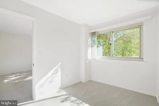 a view of an empty room with windows