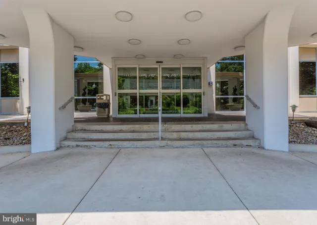 a view of a house with a large space and windows